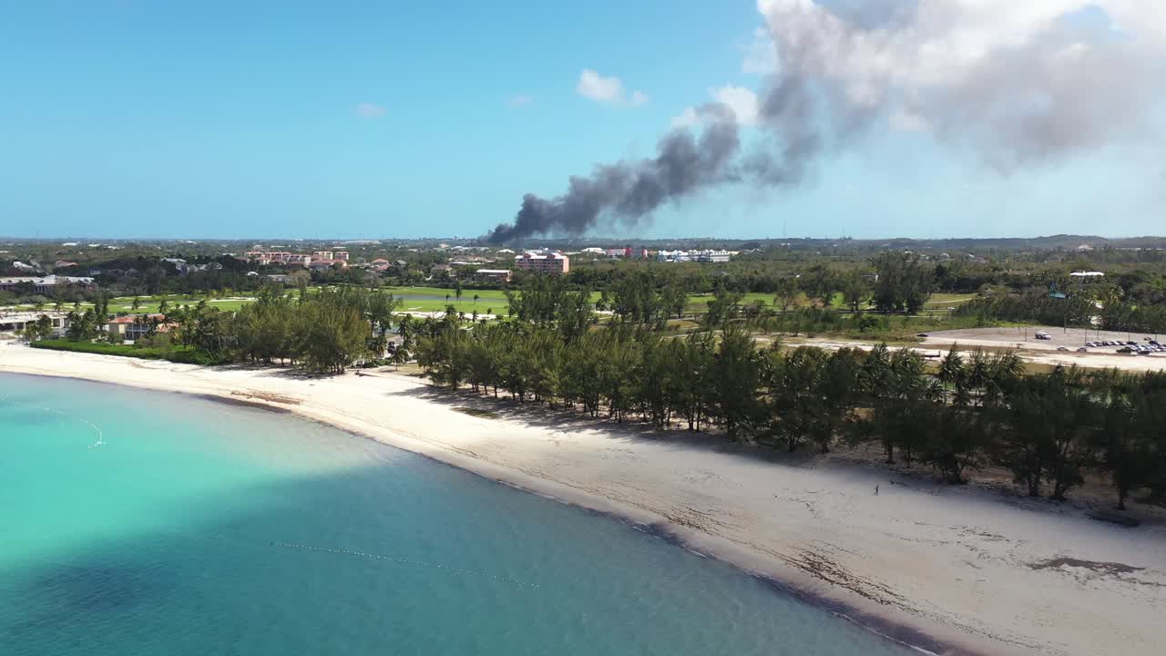 Drone Aerial of Smoke From Wild Fire in Nassau, Bahamas, View From Beach