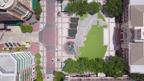 drone top down sugar land city hall in houston texas, freeway i 69. aerial shot of the sugar land town square. bird eyes view of the sugar land town square plaza in a sunny day.