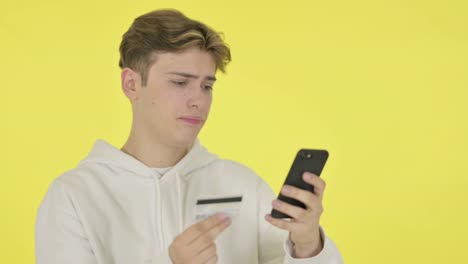 Online Shopping Failure on Smartphone by Man on Yellow Background