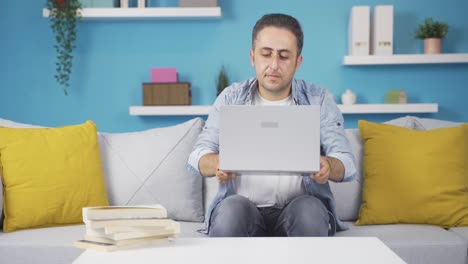 Concentrated-man-working-on-laptop.