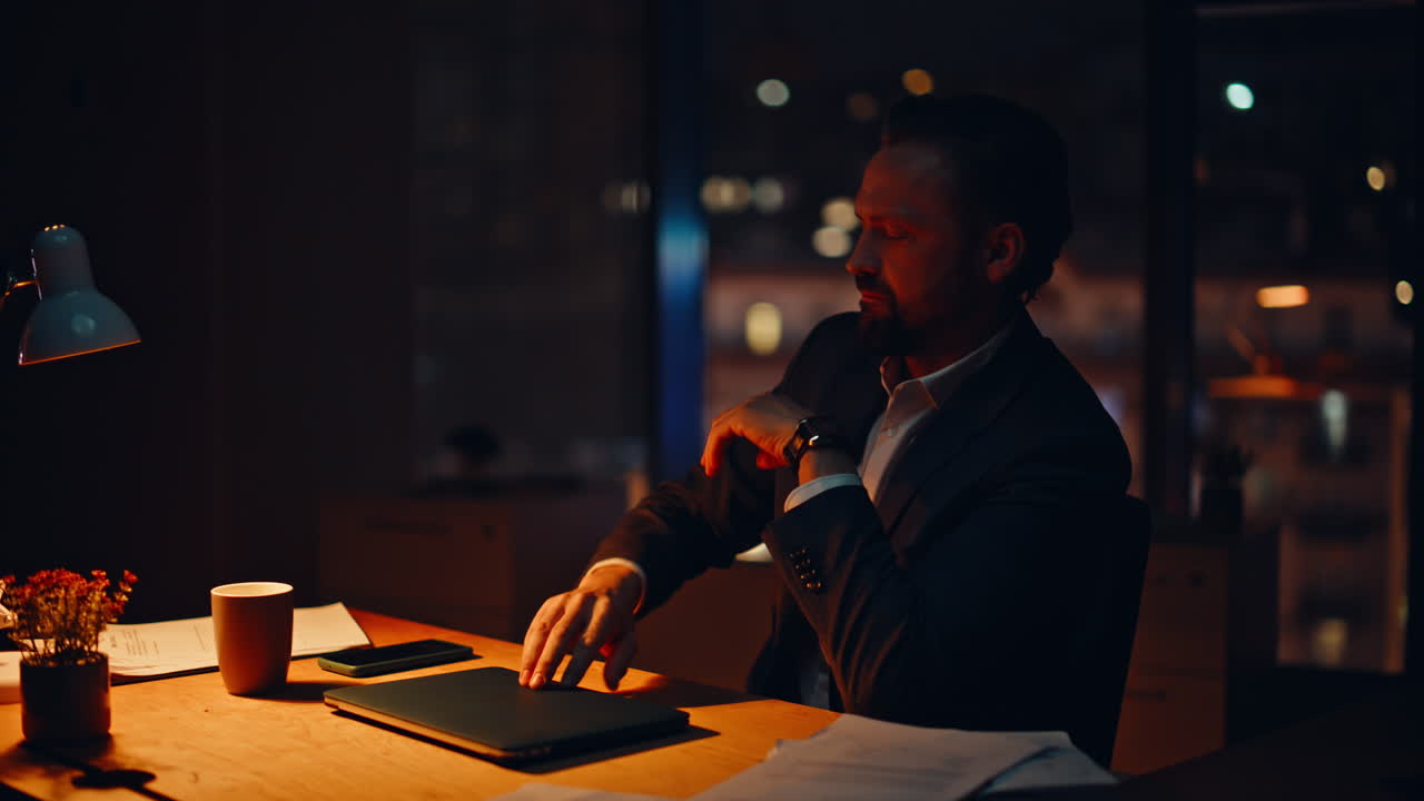 Tired businessman feeling burnout dark workspace closeup. Worker closing laptop