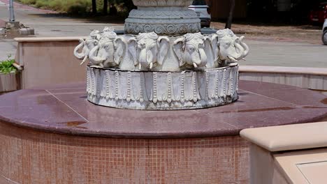 artistic-white-marble-jain-temple-holy-pillar-with-bright-blue-sky-at-morning-from-unique-angle-video-is-taken-at-Shri-Digamber-Jain-Gyanoday-Tirth-Kshetra,-Nareli,-Ajmer,-Rajasthan,-India