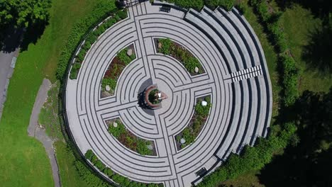 top down view rotating around cullen central park with its circular monument of remembrance in whitby, canada