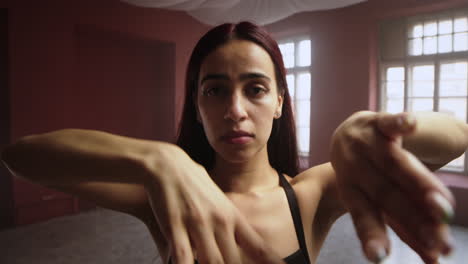 Young-woman-dancing-in-a-classroom