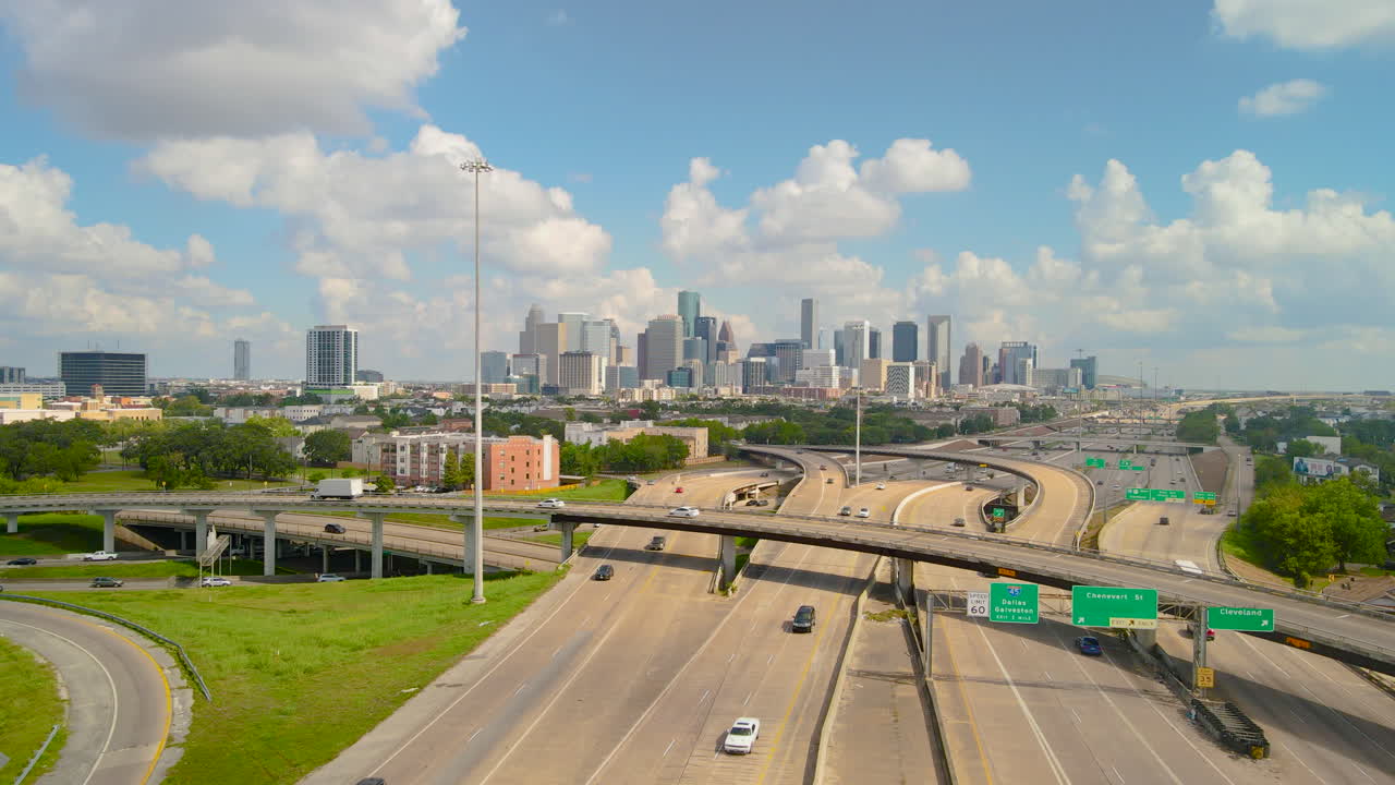 Drone shot Texas freeway 288 leading to downtown Houston. City of Houston northbound from Texas 288, I69 and I45 intersection. Aerial shot Houston transportation to downtown.