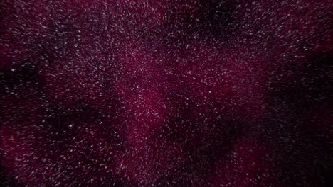 vibrant red spill on dark surface abstract close-up of paint or liquid