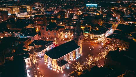 Aerial-hyperlapse-showing-buildings,-cars-and-city-landscape