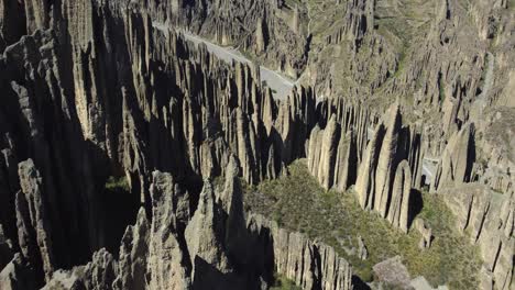 Flyover-sharp-eroded-rock-spires,-Valle-de-las-Animas-near-La-Paz-Bolivia