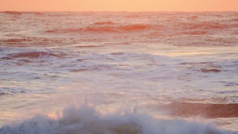 Amazing-big-waves-chrushing-at-sunset-over-the-tropical-beach-Durban,-Kwazulu-Natal,-Waves-on-the-beach-at-dawn,-Morning-at-sea,-sunrise-on-the-sea-beach,-orange-sunlight