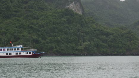 Vintage-Wooden-cruise-ship-In-The-Seascape-Of-Ha-Long-Bay-In-Vietnam