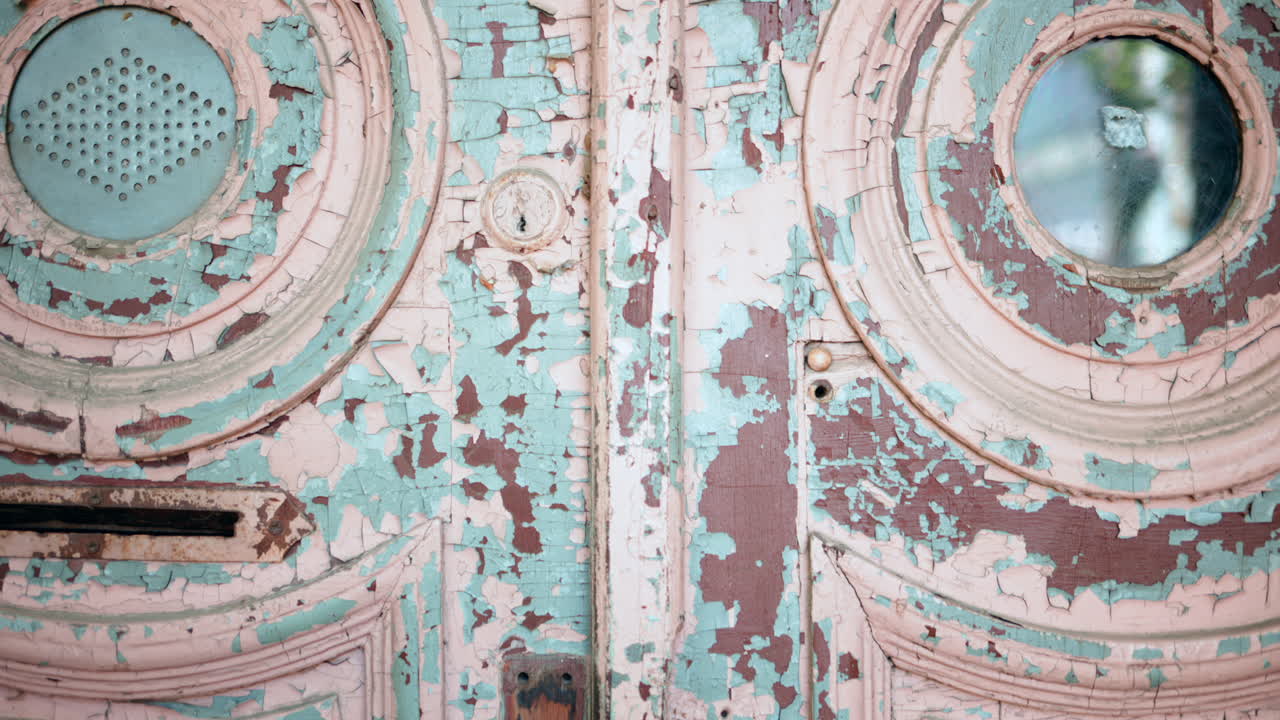 Close up of an old, wooden door with chipped paint