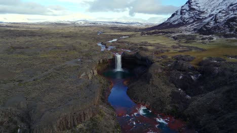 smooth dolly shot glides over agrio waterfall, capturing its majestic flow and natural beauty