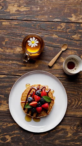 pancakes with berries and honey