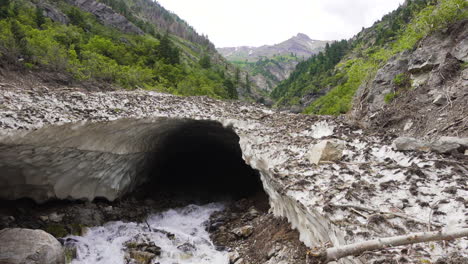 The-tunnel-under-the-ice-and-snow-from-the-melting-avalanche-in-Provo-canyon,-Utah