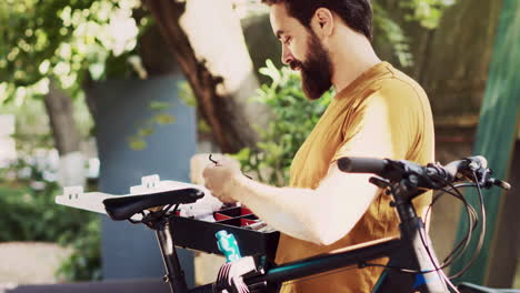 Man-holds-and-inspects-bicycle-toolkit