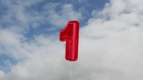 animation of a number one red balloon over sky in the background.