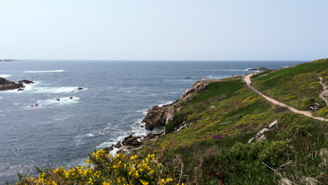 Seascape-A-Coruna-Coastline-with-Hiking-Trail,-Gentle-Pan-Right