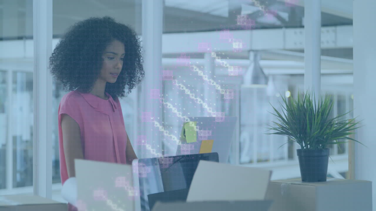 office woman typing on laptop in modern business open-plan office, showing floating data charts