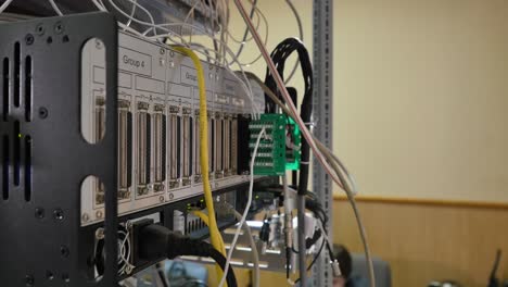 network equipment rack with cables and connections