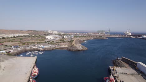 aerial flying over moored ships at port of sines in portugal