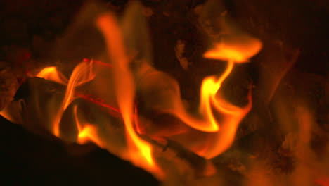 slow motion close-up, flames blazing in a hot fire