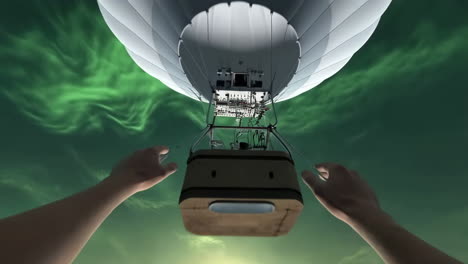 hot air balloon floating under a green aurora sky
