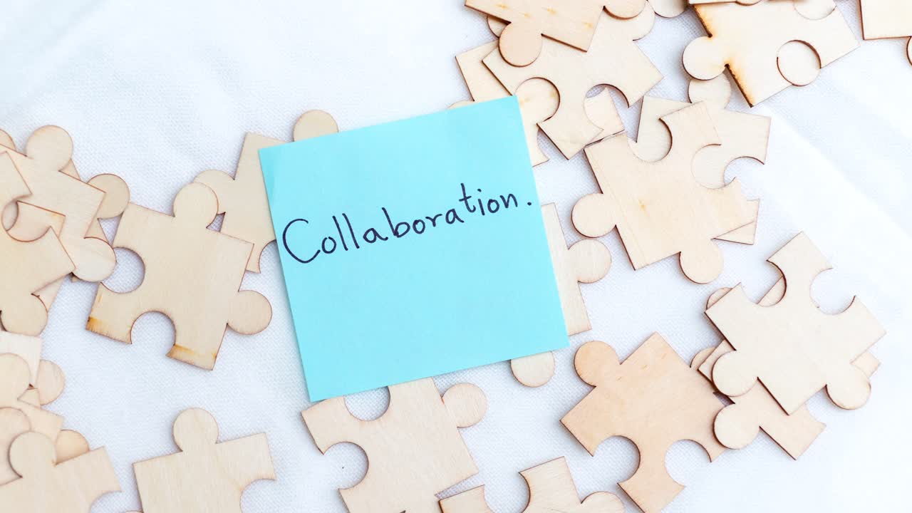 A captivating scene showcasing teamwork with puzzle pieces and a note collaboration.