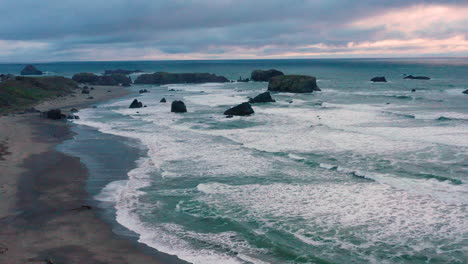 aerial of bandon beach and table rock in southern oregon, united states