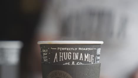 hot coffee in single-use mug, not ecological