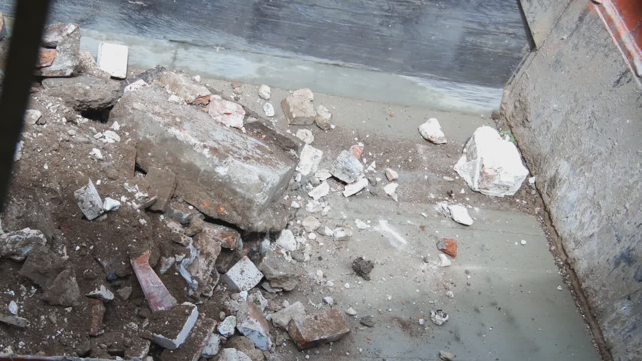 Excavator With Bucket Loads Construction Brick Scrap To The Truck