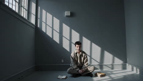 person sitting in a room with books