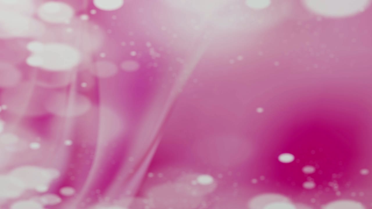 una variedad de rosquillas heladas cayendo frente a un fondo de chicle pop rosa