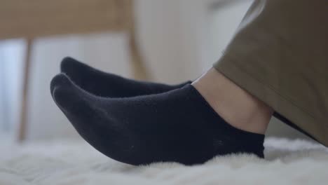 black socks on fluffy carpet