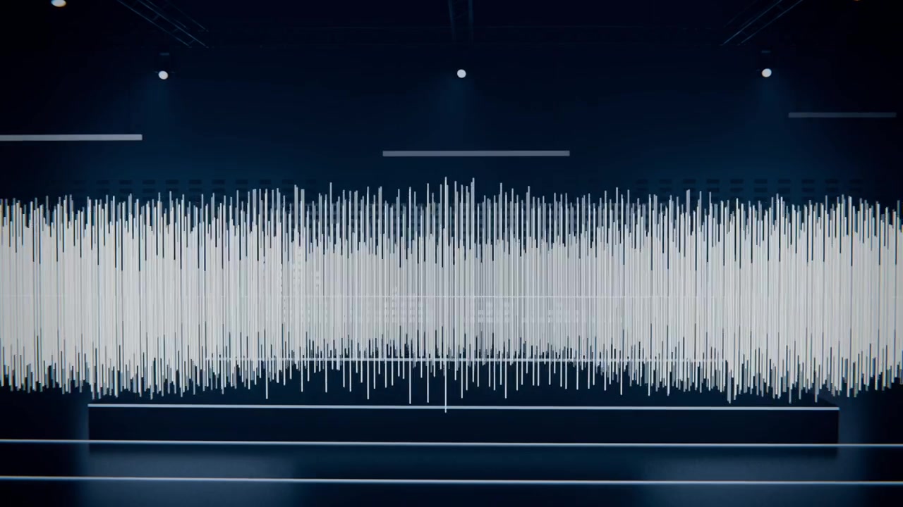 Forma d'onda audio in espansione che risponde al suono in ingresso, sollevandosi sopra una piattaforma con riflettori