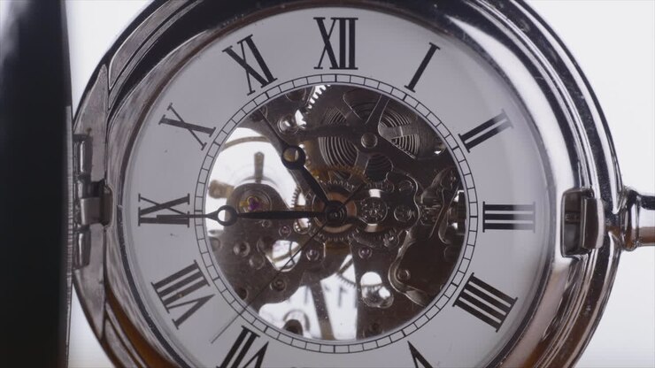 Vintage Pocket Watch Mechanism With Hands Moving Fast - macro