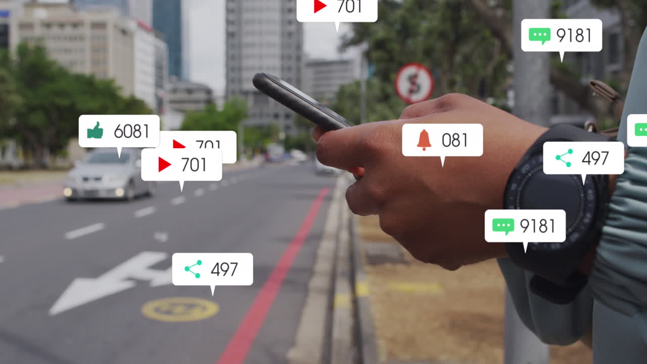 Animation of social media icons against mid section of man using smartphone on the street