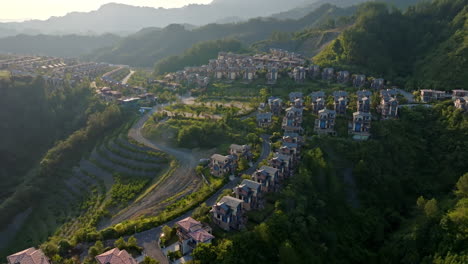 aerial view in front of holiday homes, in the mountains of china, sunrise