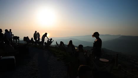 Scenic-slow-motion-of-many-people-enjoying-sunset-view-at-frozen-cherry-club