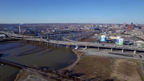 A-static-area-wide-shot-of-Interstate-95-afternoon-traffic-and-the-Baltimore-city-skyline