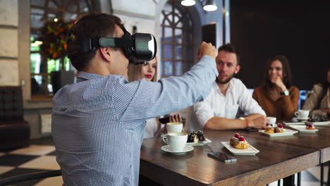 the people with virtual reality headsets on a construction site. the woman shows to group of architects and engineers the project of future interior of the room in the 3d simulator