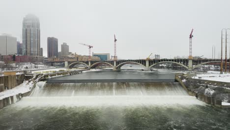 st anthony falls flowing down mississipi river in winter