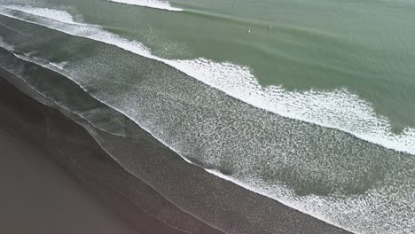 cinematic flight over raglan beach in new zealand