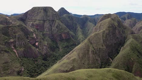 grassy summit ridge flyover: rugged remote mountains in bolivia andes