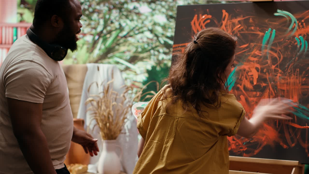 Couple painting together in art studio