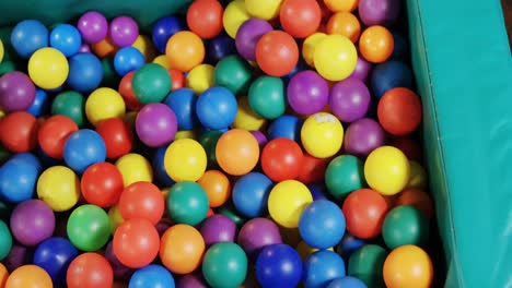 boy playing in ball pool 4k