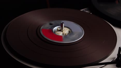 reel-to-reel audio tape spinning on playback or recording, vintage professional magnetophone, close up