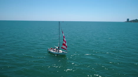 sailboat cruise at serene seascape. yacht sailing in open sea at windy day, aerial view
