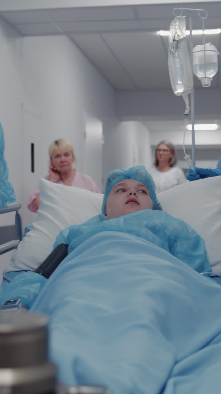 Mom supports lying on gurney kid before operation 4k 2025 08 04 04 51 13 utc.mov | african american, care, caucasian, child