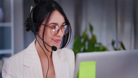 technical support woman talks to customer through headset