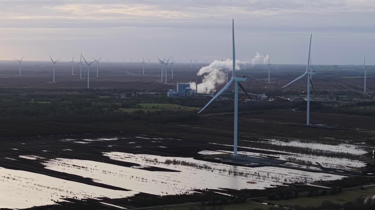 Wind turbines in Irish bogland with Edenderry power station in the background